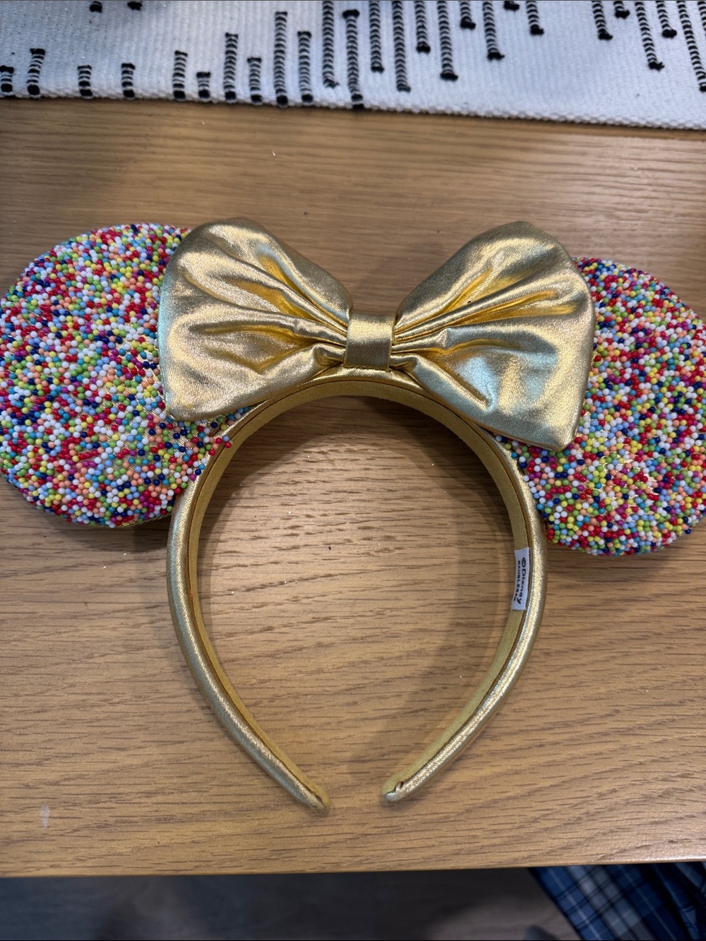 BaubleBar Gold Bow Headband with Multicolor Sprinkle Ears